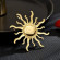 Брошь ювелирный сплав с напылением золотом солнце J11587CJJ