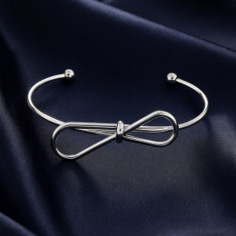 Браслет-кафф с декоративным узлом и сферическими наконежниками 1J12458CJJ