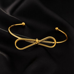 Золотистый браслет-кафф с центральным элементом в виде банта 1J12459CJJ Золотистый браслет-кафф с центральным элементом в виде банта 1J12459CJJ