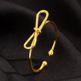 Кольцо с золотистым покрытием в форме изящного банта 1J12461CJJ Кольцо с золотистым покрытием в форме изящного банта 1J12461CJJ